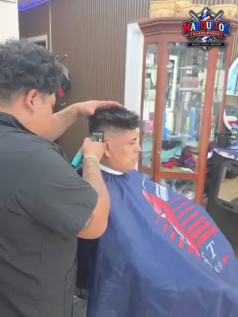 Marcos detailing the fade with clippers